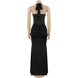 Detailed back view of a black halter maxi dress with ruched mesh and bow tie design