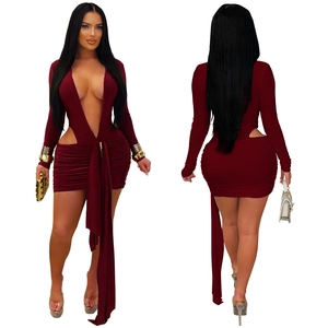Detail of burgundy deep V-neck mini dress showing hollow cut-outs and side ribbons
