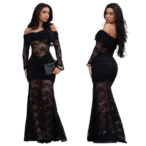 Detail of off-shoulder black lace evening dress showing intricate floral embroidery and pleats