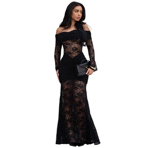 Close-up of sheer floral lace detailing on the waist and sleeves of this black dress