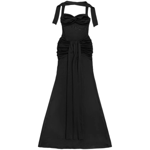 Detail of ruched waist design and elegant draped ribbon on a black halter maxi dress