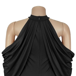 Detail of elegant black off-shoulder dress featuring halter neckline and back zipper closure