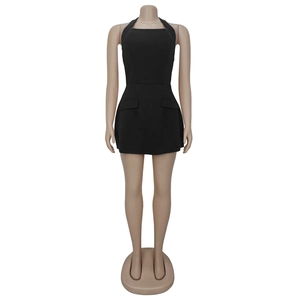Detail of black halter mini dress with off-shoulder neckline and decorative pockets
