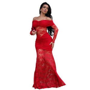 Close-up detail of red off-shoulder lace evening dress with sheer floral embroidery