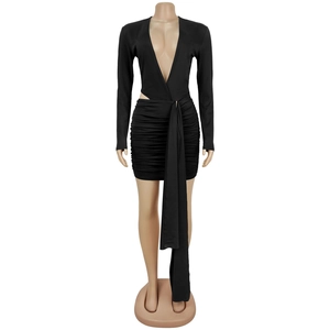 Detail of black mini dress with deep V-neck, side cut-outs and elegant long waist streamers