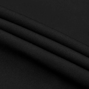 Macro della trama del tessuto a maglia nero con motivo a nido d'ape ed elasticità