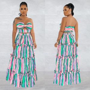 Detail of two-piece striped tube top and high waist tiered maxi skirt with wavy prints