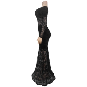 Detail of elegant black lace patchwork on off-shoulder mermaid dress sleeve and hem