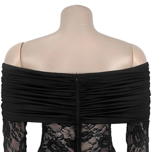 Detail of black off-shoulder lace dress showing back zipper and floral fabric texture