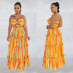 Close-up of vibrant striped tube top and layered ruffle maxi dress set for women