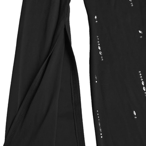 Close-up detail of silver rhinestones and high-slit design on elegant black fabric