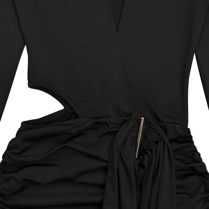 Detail of black V-neck dress featuring side cut-outs and a gold metallic bar accent