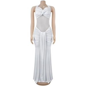 Detail of white halter neck dress featuring sheer mesh panels and front knot design