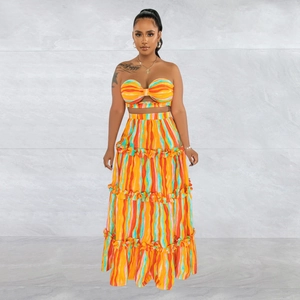Chic two-piece summer set with striped tube top and tiered maxi skirt in vibrant colors