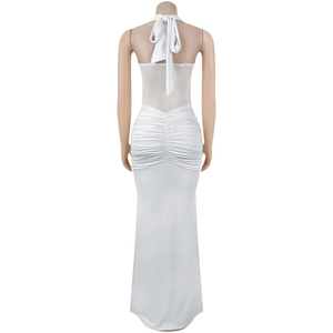 Close-up of white halter dress featuring sheer mesh back panel and elegant ruching details