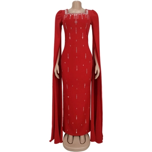 Detail of red long sleeve dress with square neckline and intricate rhinestone trim