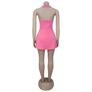 Back view of a pink halter mini dress with an open back and invisible zipper closure