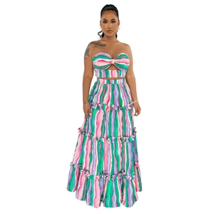 Detail of colorful vertical striped tiered maxi skirt and strapless twist crop top
