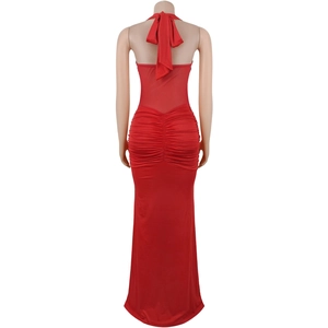 Detail of red halter backless dress with sheer mesh panel and elegant ruching