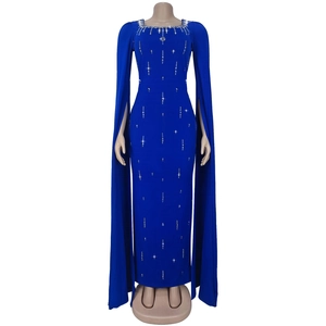 Detailed view of royal blue elegant dress with rhinestones and long cape sleeves