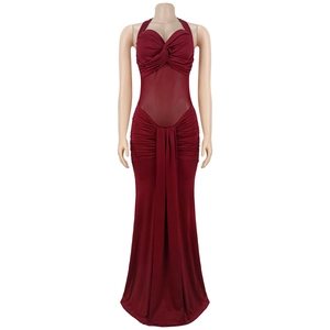 Detail of burgundy halter dress featuring mesh waist panels and elegant ruched fabric texture