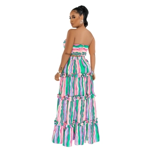 Detail of bohemian two-piece set with colorful wave striped print and tiered maxi skirt