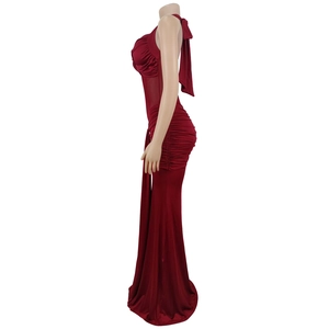 Close-up of wine red halter dress featuring backless design and ruched details