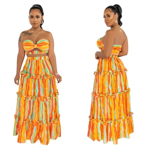 Detailed close-up showing the twisted bandeau top and layered tiered maxi skirt design