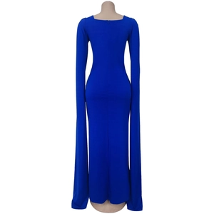 Detail view of the back of a navy blue evening gown with dramatic cape sleeves