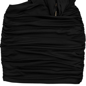 Detailed view of black ruched fabric texture with central gold metal decorative hardware