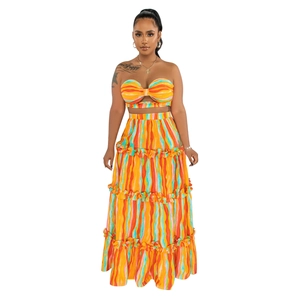 Detail view of colorful striped two-piece set featuring tube top and tiered maxi skirt