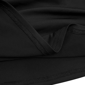 Detail of high-quality overlock stitching on the edge of a black deep V-neck dress