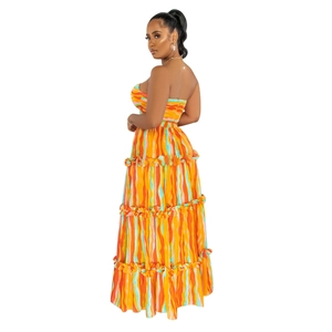 Detail of colorful striped maxi dress showing tiered ruffle hem and strapless back design