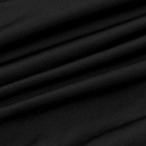 Close-up of high-elastic black knitted fabric showing fine vertical ribbed texture