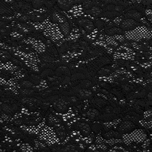 Detailed macro view of the intricate floral lace embroidery and sheer black mesh fabric