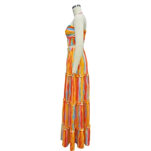 Detail of multi-color gradient striped fabric and layered ruffle hem on the long skirt