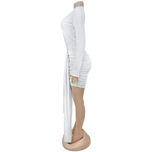 Detail of white long sleeve mini dress featuring side ruching and elegant long flowing ribbon