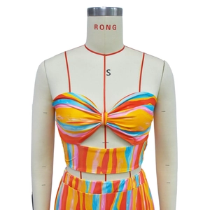 Detail of multi-color striped strapless crop top with twist knot and spaghetti straps