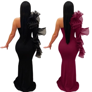 Detail of one-shoulder evening gown with layered ruffle sleeve and mermaid silhouette