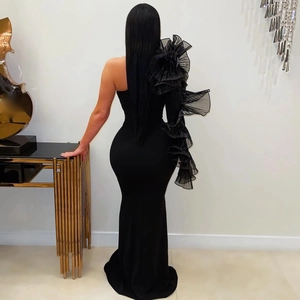 Back view of elegant black off-shoulder fishtail gown with mesh ruffle shoulder detail