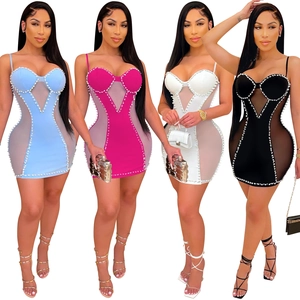 Detail of mesh paneling and pearl bead embellishments on sexy mini bodycon dresses