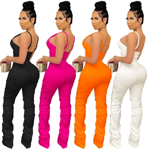 Detail of ruched leg design and slim fit silhouette on backless jumpsuits in four colors