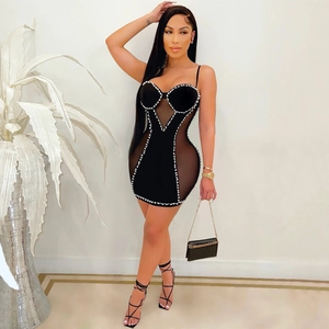 Sexy black bodycon mini dress with sheer mesh panels and white faux pearl embellishments