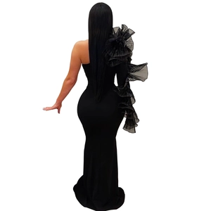 Elegant one shoulder black bodycon dress featuring dramatic ruffled lace sleeve and mermaid hem