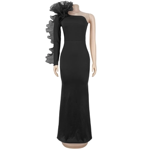 Detail of elegant black slim evening dress with ruffled mesh sleeve and one-shoulder design