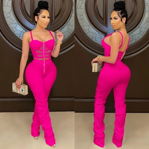 Detail view of pink two-piece set featuring mesh paneling and side ruching design