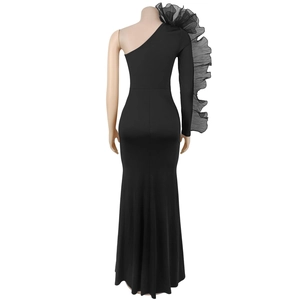 Rear view of sleek black one-shoulder evening dress with ruffled mesh sleeve detail