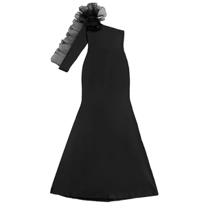 Close-up of the elegant one-shoulder dress featuring ruffled organza lace and a fish tail hem