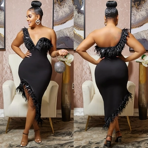 Detail of V-neck off-shoulder black dress with feather trim and asymmetric hem design