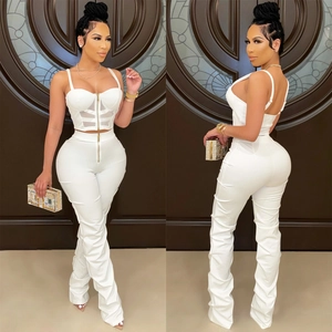 Detail of white corset top with metal zipper and mesh panels for women's two-piece set